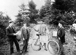 view Morris Evans with the cycle he used to ride around the countryside selling his products