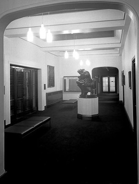 Reception desk of W.H.M.M. and statue of Jenner