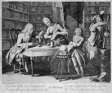 An apothecary making up a prescription using scales, his wife holds a recipe for him and two assistants are working with the bellows and pestle and mortar. Line engraving by F. Baretta after P. Mainoto.