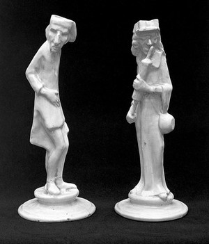 view Candlesticks: One figure has an enema; the other has a stomach ache.