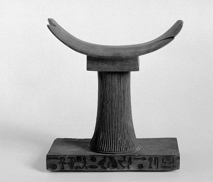 Egyptian wooden pillow with inscription on base; translation; The Chief Doctor of the King, the faithful vassal of Ptah, Khnemarkh