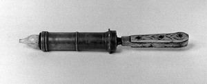 view Small pewter syringe with pistol handle, ivory inlay.