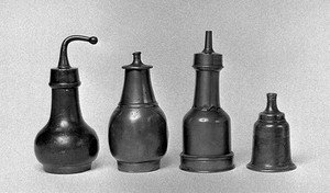 view 4 Pewter feeding bottles, 18th and 19th century. First 18th, second 18th c. and French, third 19th c. French. Fourth etched floral design 'A.W. 1770.