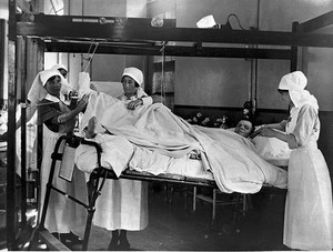view World War One: soldier looked after by nurses