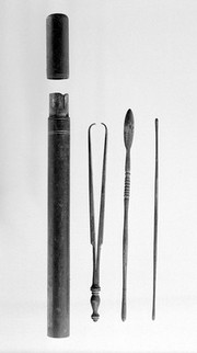 Probes (2), forceps, bronze double ended in bronze cylinder