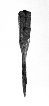 Surgical instruments: Roman scarple handle, bronze, terminating in blunt dissector. Remains of iron blade. 3 1/4" long
