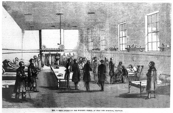 Queen Victoria with her entourage visiting invalided soldiers at Fort Pitt Hospital, Chatham. Wood engraving, 1855.