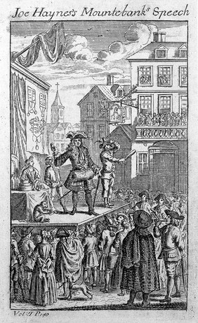 An itinerant medicine vendor selling his wares from a stage to a large audience in a town square. Engraving.