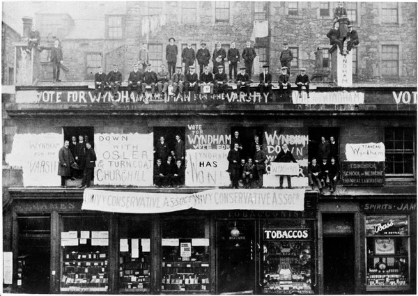 Edinburgh School of Medicine. Chemical laboratories. Early photograph of students on the roof and out of windows during an election.