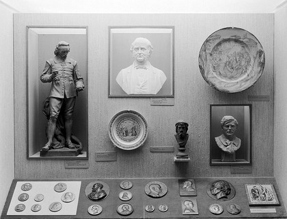 Wellcome museum: show case with statue, ceramics and medals. On the second floor.