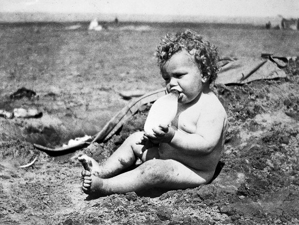 Baby with feeding bottle, 1922