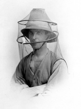 Postcard: mosquito net to be worn as a veil.