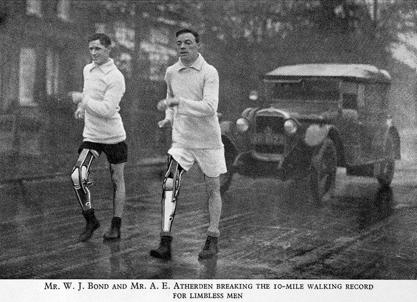 Two athletes with artificial right legs walking. 1925