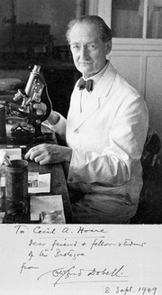 Portrait of Clifford Dobbell at a laboratory bench; with signed inscription to Cecil Hoare dated 1949