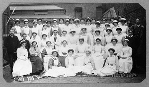 view General Lying In Hospital, York Road, Lambeth: hospital staff. Photograph, 1908.