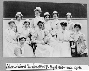 view General Lying In Hospital, York Road, Lambeth: labour ward staff and students. Photograph, 1908.