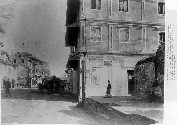 A plague house in Bombay: the wall has been marked with circles. Photograph, 1896/1897.