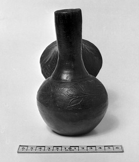 American colonial black pot with head attached to handle, view of pot