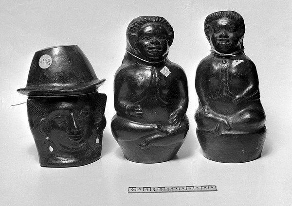 Three American colonial black pot-figures, front views