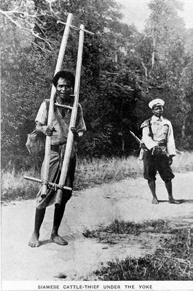 A cattle thief in Siam punished by having a yoke fixed around his neck. Process print, 19--.