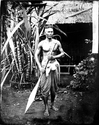 Siamese boatman, holding an oar. Siam