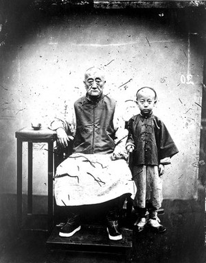 view A mandarin and his son, Canton, Kwangtung province, China.