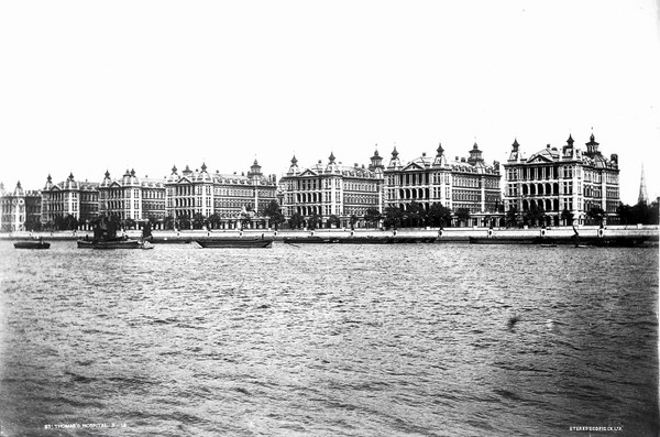 St Thomas's Hospital, Lambeth: exterior seen from across the Thames. Photograph.