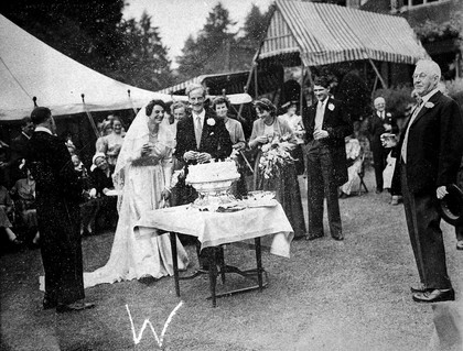 Group portrait with l. to r., Patricia Lewis, Sinclair Watson, and (far right) Sir H. Dale, at the wedding of Patricia Lewis and Sinclair Watson,