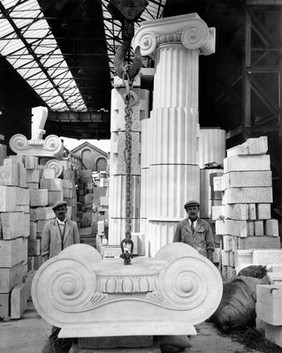 Two workmen with stonework for Wellcome Building, 1931