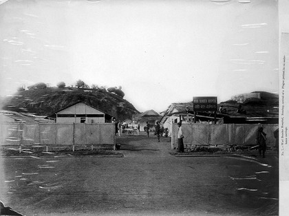 A plague patient being transported on a manually propelled ambulance carriage to the Wari Bunder Hospital in Bombay. Photograph, 1896/1897.