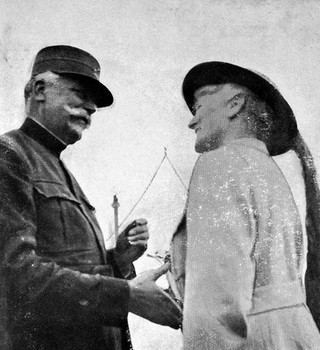 Mrs K.M. Harley being decorated with Croix de Guerre