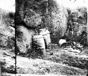 view Jars containing human remains awaiting interment, Amoy, Fukien province, China.