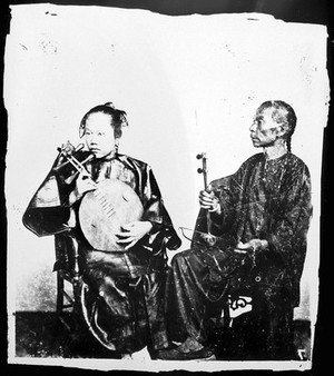 view Two Chinese musicians with their instruments, Canton, Kwangtung province, China