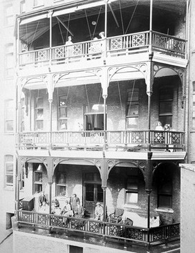 Great Northern Central Hospital, Holloway Road, London: patients on the balconies of wards 4, 5 and 6. Photograph, 1912.