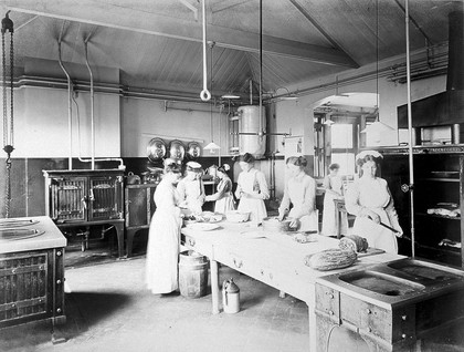 Great Northern Central Hospital, Holloway Road, London: nurses working in the kitchen. Photograph, 1912.