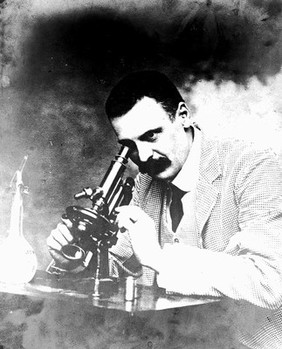 Portrait of C. Donovan using a microscope