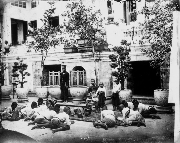 Prince Chulalongkorn of Siam [Thailand] (seated, centre), with Prince Bhanugrangsi Savanwongse (standing next to him) and Prince Kasemsan Sophak (standing, right). Photograph by John Thomson, 1866.