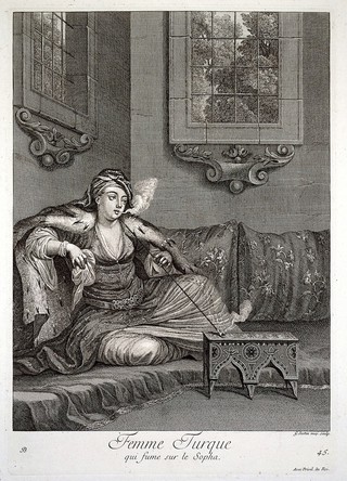 Constantinople: a lady seated on a sofa, smoking a pipe. Engraving by G. Scotin, 1714, after J.B. Van Mour.