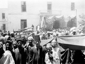 view Bani Suef, Egypt: pilgrims at Biba. Photograph by W.S. Blackman, 192-.