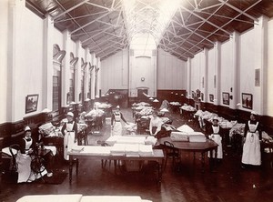 view Claybury Asylum, Woodford, Essex: a linen room. Photograph by the London & County Photographic Co., [1893?].