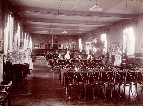 Claybury Asylum, Woodford, Essex: a dining room (?). Photograph by the London & County Photographic Co., [1893?].