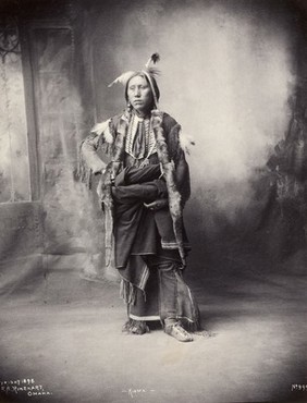 An American of the Kiowa tribe. Platinum print by F.A. Rinehart, 1898.