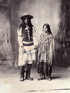 view A native American man and woman. Platinum print by F.A. Rinehart, 1898.