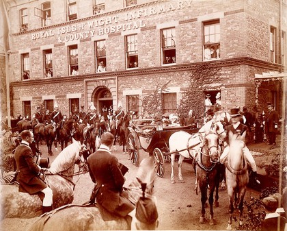 Royal Isle of Wight Infirmary and County Hospital: exterior with Queen Victoria and attendants visiting, 1899. Photograph.