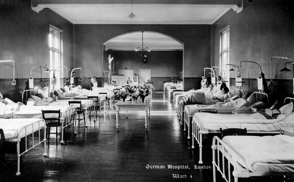 The German Hospital, Dalston: a ward with patients and nurses. Photograph by Marshall, Keene & Co.