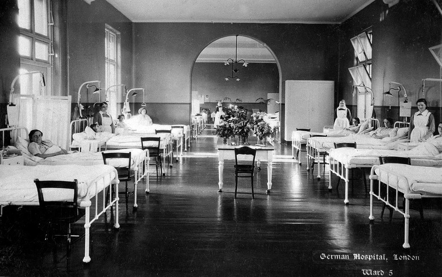 The German Hospital, Dalston: a ward with patients and nurses. Photograph by Marshall, Keene & Co.