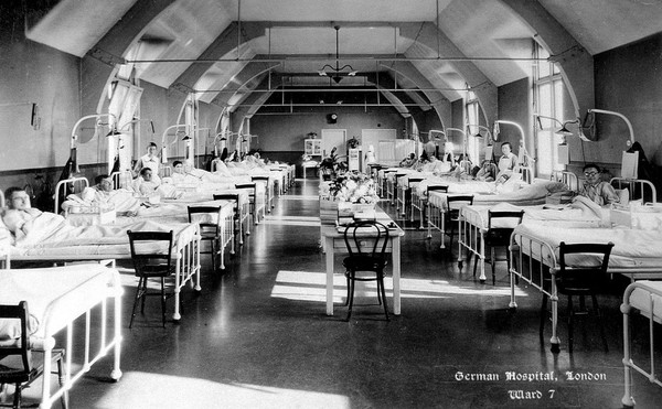 The German Hospital, Dalston: a ward with patients and nurses. Photograph by Marshall, Keene & Co.