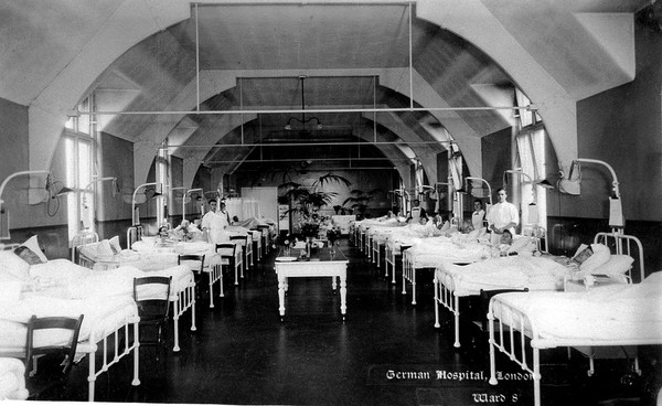 The German Hospital, Dalston: a ward with patients and nurses. Photograph by Marshall, Keene & Co.