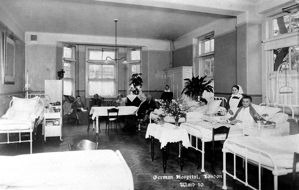 The German Hospital, Dalston: a ward with nurses and patients. Photograph by Marshall, Keene & Co.