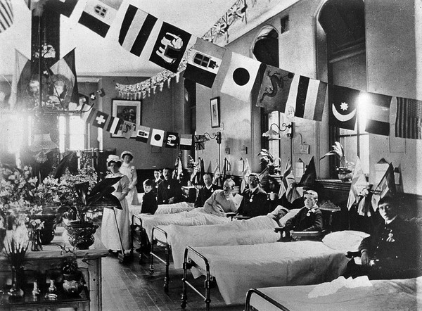 Hahnemann Hospital and Homœopathic Dispensaries, Liverpool: a ward, decorated with flags possibly for the coronation of King George V. Photograph.